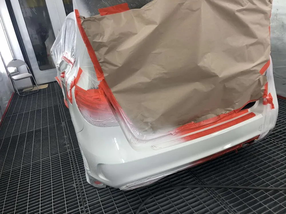 Home | Non-Fault Accident Claim & Vehicle Recovery London Rear of a car masked for paintwork at an approved accident repair centre managed by SSS Claims London.